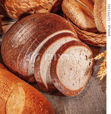 Fresh baked bread. Assorted bakery products loafs of bread and rolls... 127051381