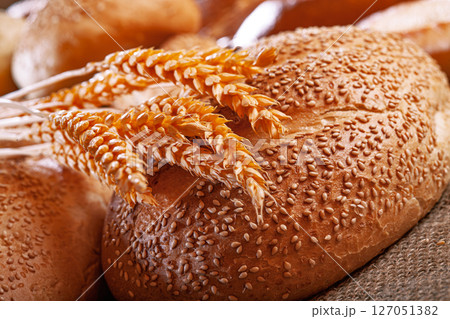 Fresh baked bread. Assorted bakery products loafs of bread and rolls... Fresh baked bread. Assorted bakery products loafs of bread and rolls... 127051382