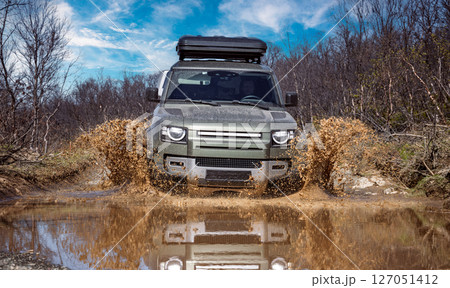 Off road tourist car rides off-road in the highlands. 127051412