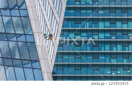 Professional Window cleaners at work. 127051415
