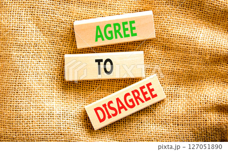 Agree to disagree symbol. Concept words Agree to disagree on beautiful wooden block. Beautiful canvas table canvas background. Business and agree to disagree concept. Copy space. 127051890