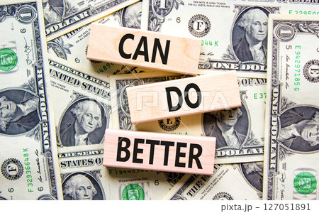 Can do better symbol. Concept words Can do better on beautiful wooden blocks. Dollar bills. Beautiful background from dollar bills. Business and can do better concept. Copy space. 127051891