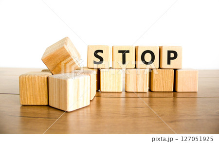 Stop symbol. Concept word Stop on beautiful wooden blocks. Beautiful wooden table white background. Business, lifestyle, support and stop concept. Copy space. 127051925