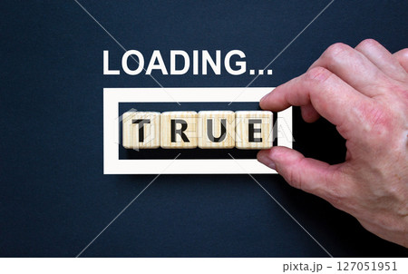 True symbol. Concept word Loading True on beautiful wooden blocks. Businessman hand. Beautiful black table black background. Business, lifestyle, support and true concept. Copy space. True symbol. Concept word Loading True on beautiful wooden blocks. Businessman hand. Beautiful black table black background. Business, lifestyle, support and true concept. Copy space. 127051951
