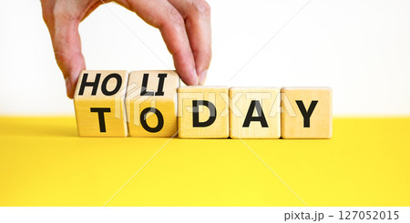 Today is holiday symbol. Concept word Today and Holiday on wooden cubes. Businessman hand. Beautiful yellow table white background. Business and today is holiday concept. Copy space. Today is holiday symbol. Concept word Today and Holiday on wooden cubes. Businessman hand. Beautiful yellow table white background. Business and today is holiday concept. Copy space. 127052015
