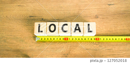 Local symbol. Concept word Local on beautiful wooden blocks. Beautiful wooden table wooden background. Beautiful yellow ruler. Business lifestyle local concept. Copy space. 127052018