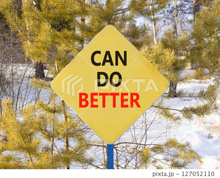 Can do better symbol. Concept words Can do better on beautiful yellow road sign. Beautiful winter forest background. Business and can do better concept. Copy space. 127052110
