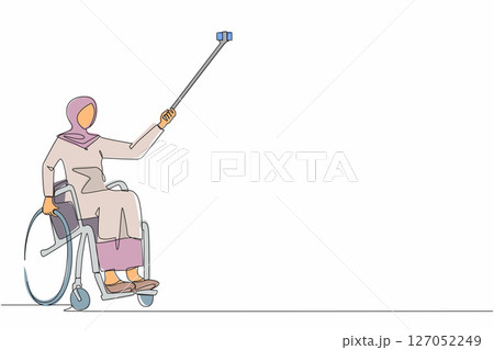 Continuous one line drawing Arabian female young wheelchair user taking selfie with phone and stick. Society and disabled people community concept. Single line draw design vector graphic illustration 127052249