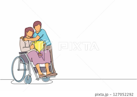 Continuous one line drawing disability woman on wheelchair with trophy cup sharing her joy from achievements and victory with her husband. Disabled people success in sport. Single line design vector Continuous one line drawing disability woman on wheelchair with trophy cup sharing her joy from achievements and victory with her husband. Disabled people success in sport. Single line design vector 127052292