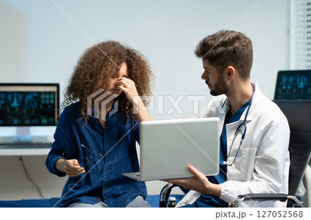 Stressed woman patient are treated by a psychologist or psychiatrist in a psychiatric clinic or hospital. Patients reported symptoms of depression, stress, irritability, and life problems. 127052568