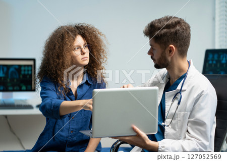 Stressed woman patient are treated by a psychologist or psychiatrist in a psychiatric clinic or hospital. Patients reported symptoms of depression, stress, irritability, and life problems. 127052569