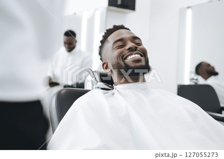 portrait of a man in a barbershop on a light background 127055273