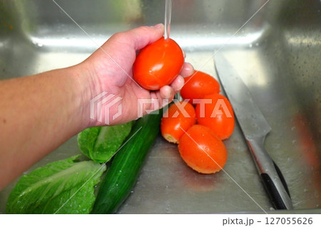 vegetables in the kitchen sink, food preparation 127055626