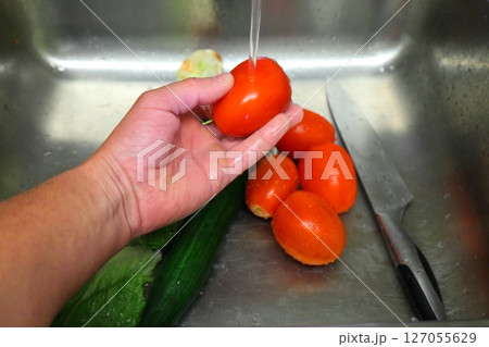 vegetables in the kitchen sink, food preparation 127055629