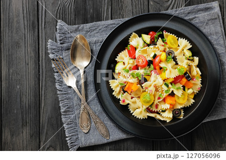 salad of farfalle pasta with veggies and olives salad of farfalle pasta with veggies and olives 127056096