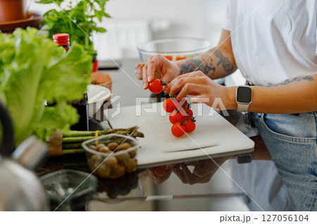 Fresh and Vibrant Ingredients Being Skillfully Prepared in a Modern Kitchen Environment Fresh and Vibrant Ingredients Being Skillfully Prepared in a Modern Kitchen Environment 127056104
