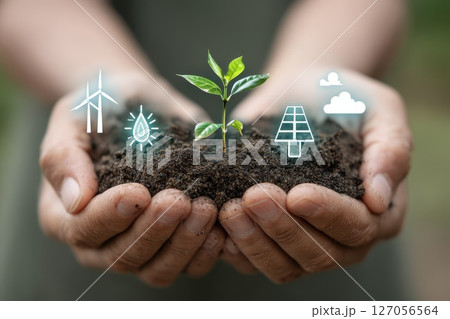 Close-up of hands holding glowing seed in soil with eco-friendly symbols representing nature Close-up of hands holding glowing seed in soil with eco-friendly symbols representing nature 127056564