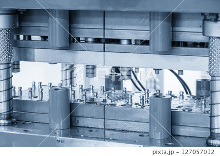 The electrical parts mass production by progressive die in the light blue scene. The electrical parts mass production by progressive die in the light blue scene. 127057012