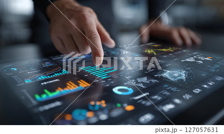 Interactive data analysis on a digital touchscreen display showcases various charts and graphs highlighting significant trends and insights in real-time environments 127057631