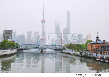 Waibaidu Bridge and Oriental Pearl tower with mist at the Bund, Shanghai Waibaidu Bridge and Oriental Pearl tower with mist at the Bund, Shanghai 127058066