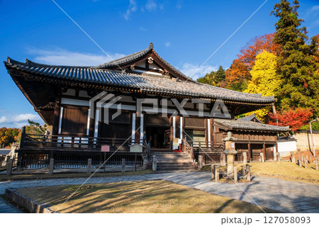 Hokkedo hall of Todaiji temple with autumn leaf and blue sky, Nara Hokkedo hall of Todaiji temple with autumn leaf and blue sky, Nara 127058093