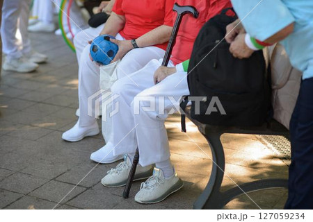 Senior Women Rest with Handball and Cane in Park Senior Women Rest with Handball and Cane in Park 127059234