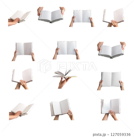 Open book held in hand, blank pages showcasing a mockup for educational or publication purposes. 127059336
