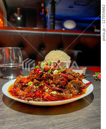 Spicy stir-fried pork with chili and sweet and sour sauce 127059862