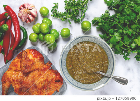 Tkemali sauce, made from green cherry plum, with ingredients on the table, tobacco chicken, top view, Georgian cuisine, no people, Tkemali sauce, made from green cherry plum, with ingredients on the table, tobacco chicken, top view, Georgian cuisine, no people, 127059900