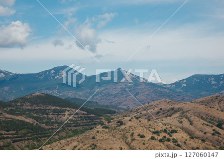 landscape from the top of the mountain to the forest and blue sky with clouds 127060147