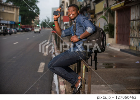 portrait of young african man, smiling. 127060462