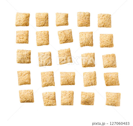 Tasty corn pillows isolated on white background top view. 127060483