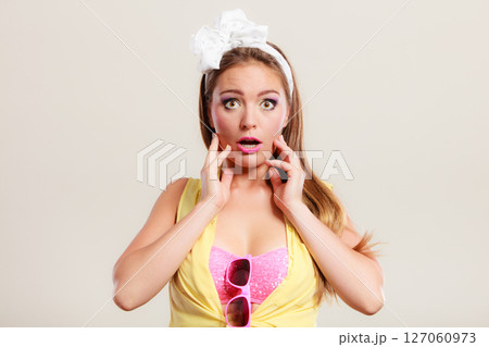 Amazed surprised pin up girl with mouth wide open. 127060973