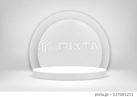 Bright white interior scene with round pedestal 127061251