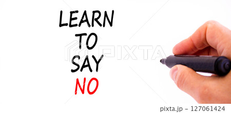 Learn to say no symbol. Concept words phrase Learn to say no on beautiful white paper. Businessman's hand. Beautiful white background. Business psychological Learn to say no concept. Copy space. 127061424