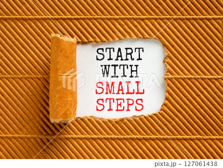 Start with small steps symbol. Concept words phrase Start with small steps on beautiful white paper. Beautiful brown paper background. Business Start with small steps concept. Copy space. 127061438