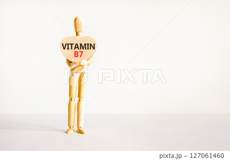 Vitamin B7 biotin symbol. Concept words Vitamin B7 on beautiful wooden heart. Doctor's model. Beautiful white background. Copy space. Medical healthy lifestyle Vitamin B7 concept. Vitamin B7 biotin symbol. Concept words Vitamin B7 on beautiful wooden heart. Doctor's model. Beautiful white background. Copy space. Medical healthy lifestyle Vitamin B7 concept. 127061460