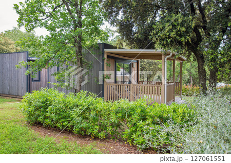 Small wooden cabin in forest. 127061551