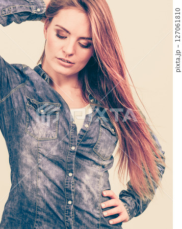 Fashionable woman with blowing hair Fashionable woman with blowing hair 127061810