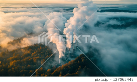 Industrial Smoke Plumes Erupting Through Foggy Forest 127063445
