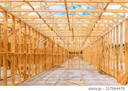 Wooden framework being constructed for large building during construction works 127064476