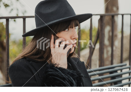 Elegant Dressed Woman On The Town Bench Having A Fun Call Close Up Elegant Dressed Woman On The Town Bench Having A Fun Call Close Up 127067428