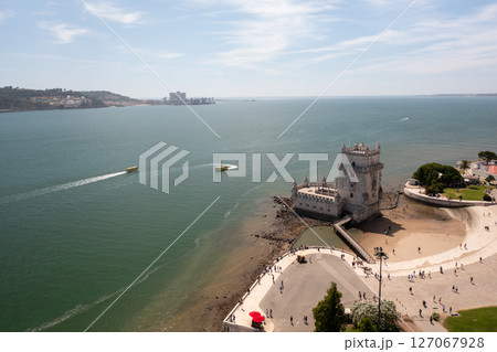 Belem Tower on Tagus River with boats creating Belem Tower on Tagus River with boats creating 127067928