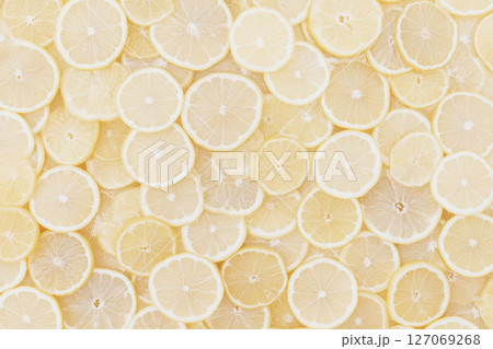 Fresh Lemon Slices on Light Background for Creative and Culinary Designs 127069268