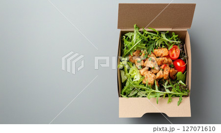 Fresh salad with grilled chicken in eco friendly packaging Fresh salad with grilled chicken in eco friendly packaging 127071610