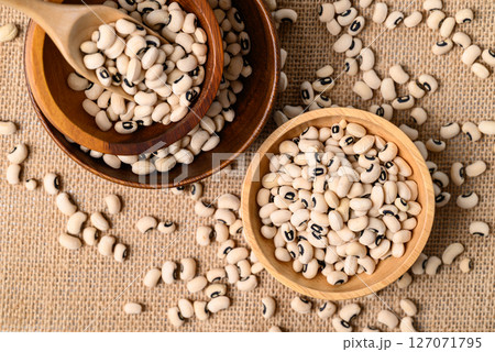 Black-eyed pea or cowpea in wooden bowl with scoop, Food ingredient, Top view Black-eyed pea or cowpea in wooden bowl with scoop, Food ingredient, Top view 127071795
