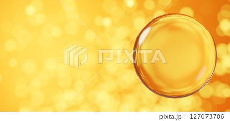 黄色背景に浮かぶ透明な球体。玉ボケ。コピースペース。3D（横長） 127073706