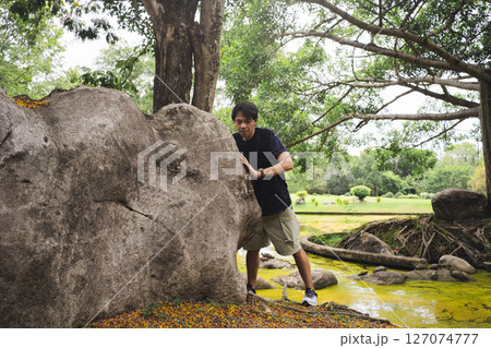 wellness concept with asian man exercise with tree in park on summer season wellness concept with asian man exercise with tree in park on summer season 127074777