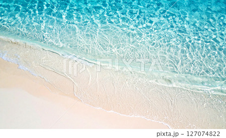 waves on the beach, sea water background, High angle view of crystal clear water gently washing over pure white sand, creating a calm, tropical seaside pattern perfect for natural background 127074822