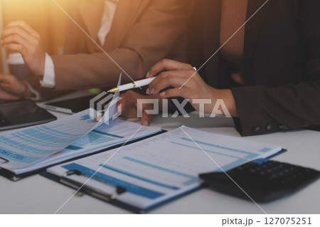 Accounting company provide finance and taxation planning for profitable cash flow, Auditor and accountant team working in office, analyze financial data and accounting record with calculator.Insight Accounting company provide finance and taxation planning for profitable cash flow, Auditor and accountant team working in office, analyze financial data and accounting record with calculator.Insight 127075251